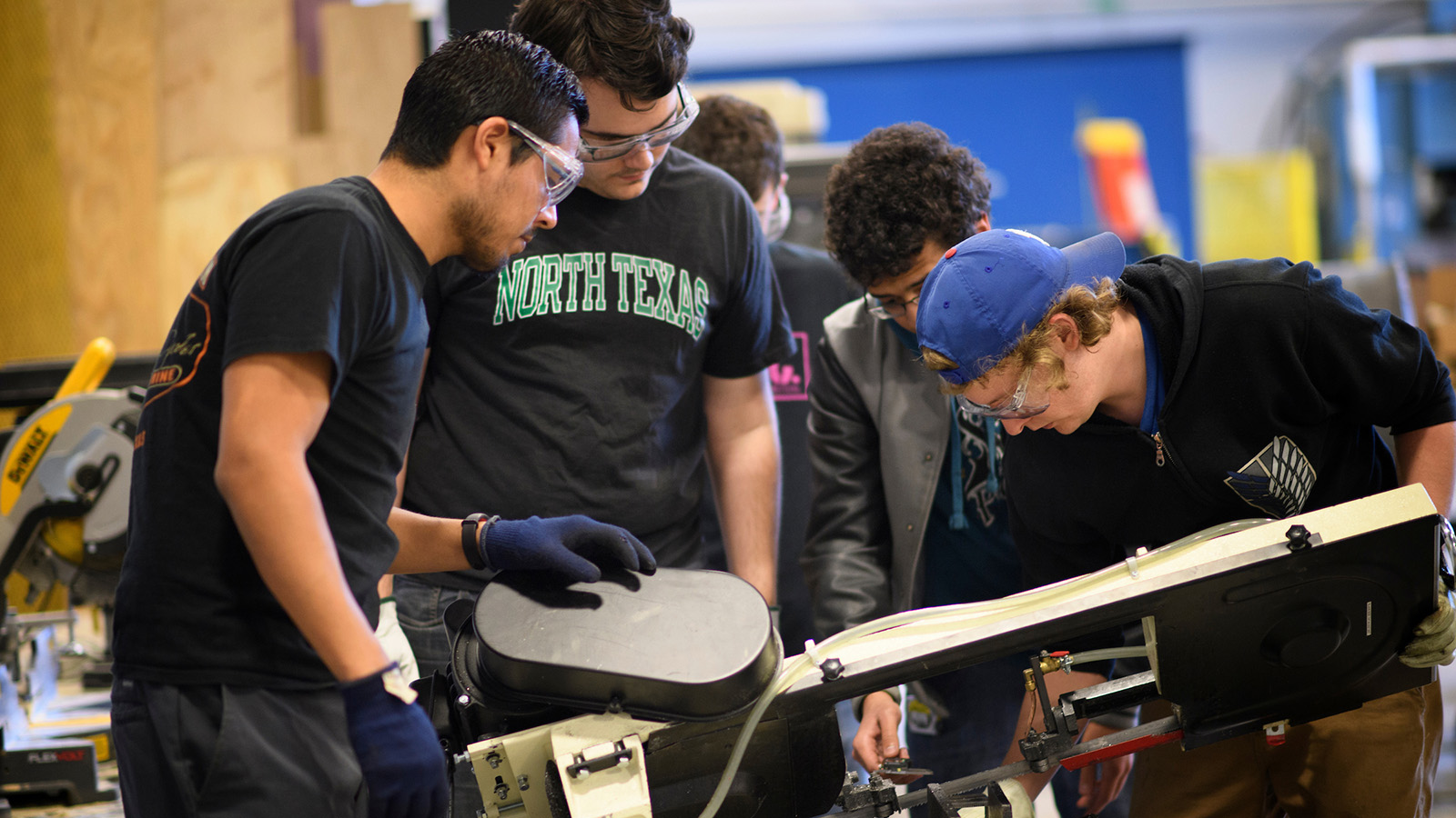 Four UNT students work on their senior design project together