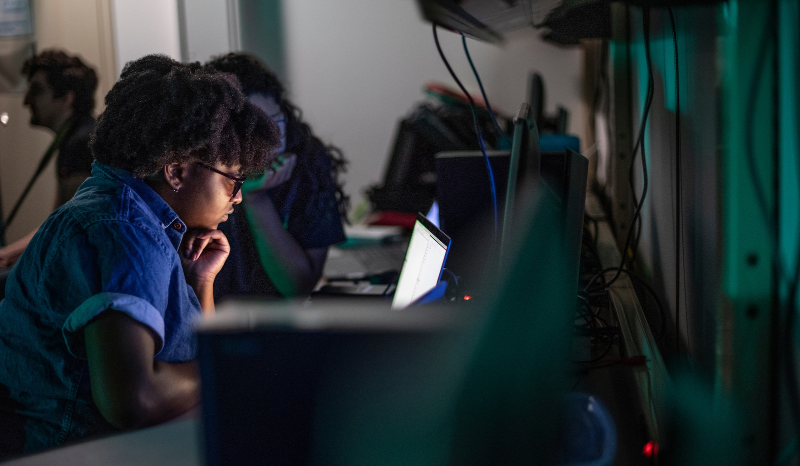 A UNT student works in front of a PC monitor