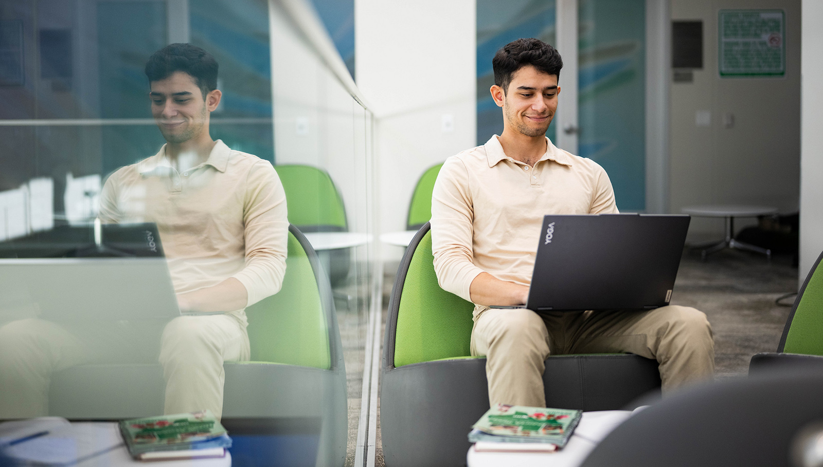 A UNT student working on a laptop