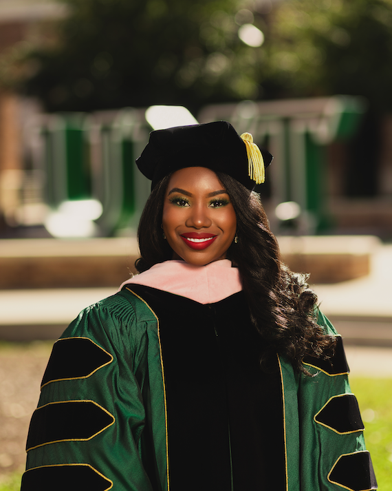 Cherisse Williams headshot with grad cap and gown