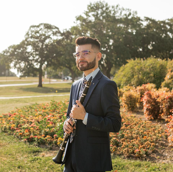 Eric Morales holding a clarinet