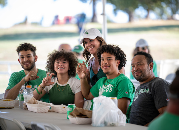 Students and alumni networking at an event