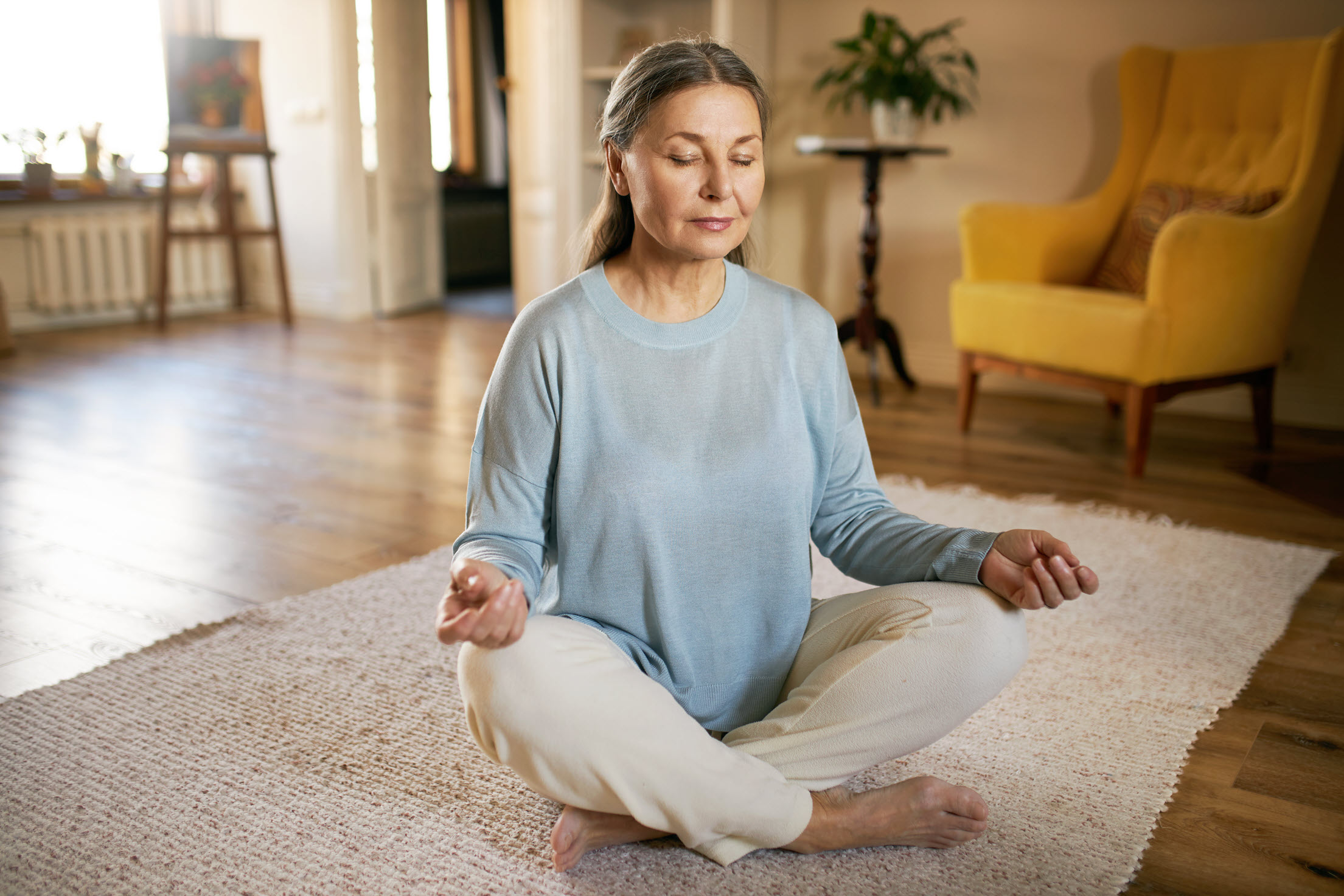 Lady meditating on floor